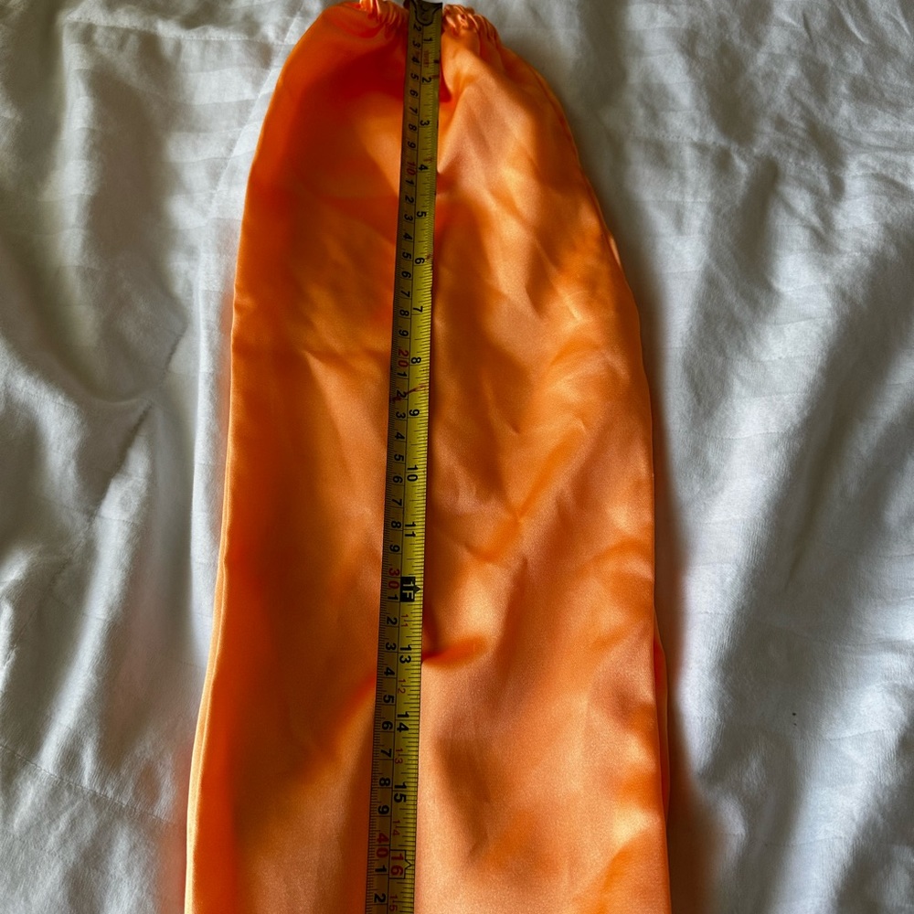 Ao dai for girl.  Green top and orange pant.